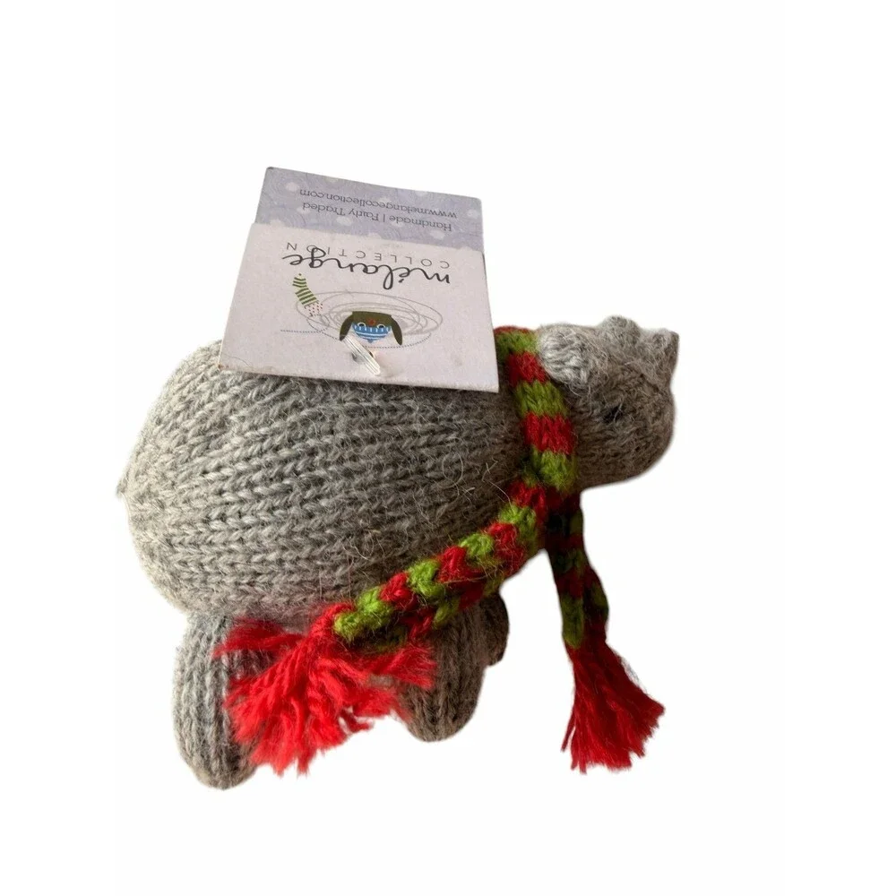 New Mélange Collection hand-knitted rhino ornament, featuring a cozy scarf
